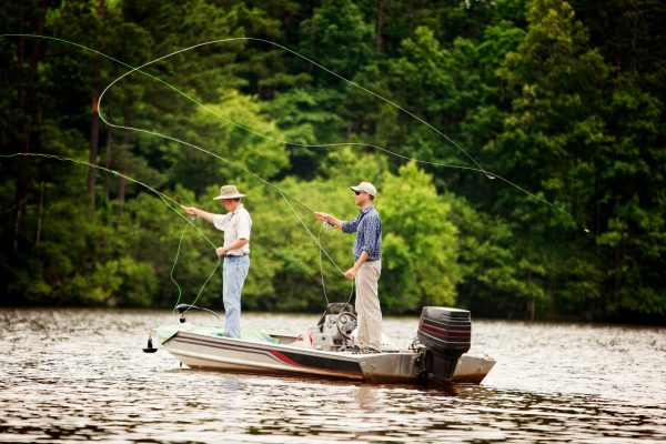 two men lake fishing from boat near asheville, nc
